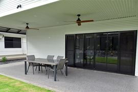 Outdoor living area with wooden ceiling fans